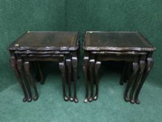 Two nests of three inlaid mahogany tables with plate glass tops