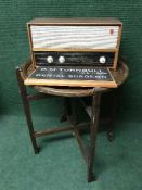 A circular folding table together with a mid twentieth century Philip's valve radio and dentist's