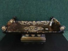 A decorative twin handled trough