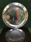 An impressive Arts and Crafts charger with red cabochon detail, by J J Buchan, diameter 56 cm.