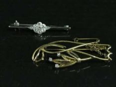 An 18ct gold and diamond set brooch, together with another white gold and dimaond brooch, 7.