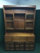 A mid twentieth century Parker Knoll teak cocktail display cabinet