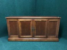 A mahogany double door low sideboard