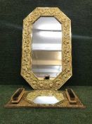 An octagonal brass framed mirror and a mirror and brush set (2)