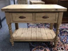 A reclaimed pine two drawer side table with thick plank top
