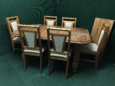 A pine extending dining table with leaf and six chairs