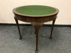 A Georgian style turn over topped walnut card table