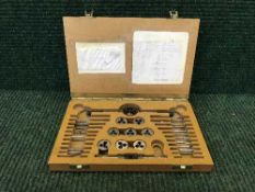 A horologist's tap and die set in box.