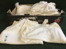 Two boxes of tagged and new lady's white cotton jumpers,