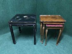 An oriental black lacquered lamp table together with a nest of three mahogany tables on cabriole