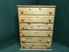 A pine six drawer chest