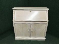 A contemporary washed pine writing bureau