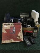 A box of Sennheiser head phones, Wam box set, remotes, mobile phones, chargers,