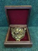 A brass compass / sun dial in a mahogany and brass inlaid box