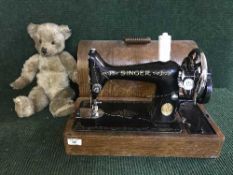 A Singer hand sewing machine in case and a mohair Teddy bear
