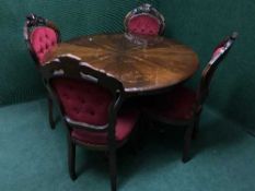 A circular Italian style dining table together with four chairs