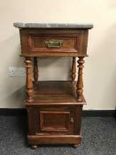 A late Victorian mahogany bedside stand with marble top