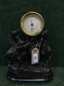 A late 19th century spelter mantel clock on wooden base