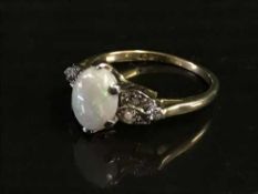 An 18ct gold opal and diamond set ring