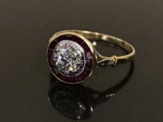 An Art Deco 18ct gold diamond and ruby set cluster ring