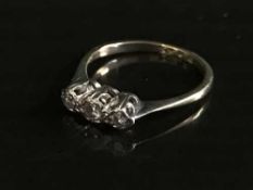 A 9ct gold three stone diamond ring, 1.