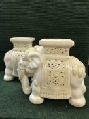 A pair of cream elephant plant stands