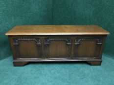 A carved oak blanket chest