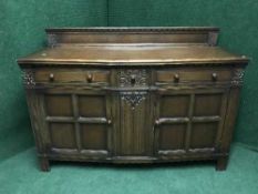 A carved oak sideboard