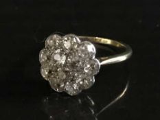 An 18ct gold old cut diamond cluster ring