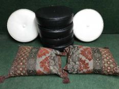 A set of six mid twentieth century black pvc cushions together with two decorative fabric cushions
