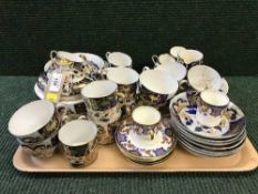 A tray of antique blue and gilt tea china,