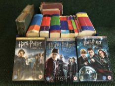 A basket of Harry Potter hard backed and paper backed books, some first editions,