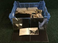 A basket of quantity of early twentieth century glass negatives including secnes of Tynemouth pier,