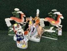 A pair of Staffordshire flat back vases depicting hunted deers and three other Staffordshire