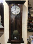 A late nineteenth century mahogany wall clock