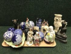 A tray of Oriental figure, jug and money box, blue and white vase,