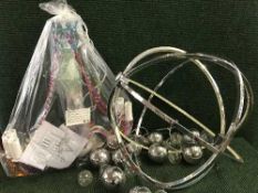 A decorative coloured glass light fitting together with two contemporary lights and three way light