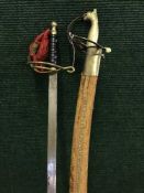 A Indian sabre in scabbard,
