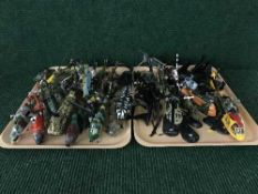 Two trays of plastic and die cast helicopters with stands