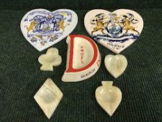 Two pottery heart shaped wall plaques,