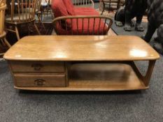 An Ercol light elm two drawer coffee table