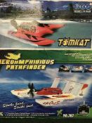 A boxed remote controlled Tom-cat together with an amphibious path finder