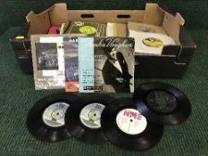 A box of 45's including The Sweet, Simon and Garfunkel,