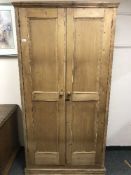 A reclaimed pine two door kitchen cupboard