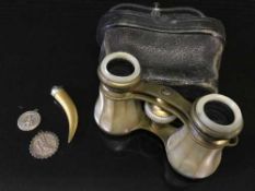 A pair of cased mother of pearl mounted opera glasses,