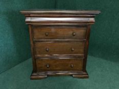 A mahogany four drawer chest on bracket feet