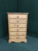A pine six drawer chest