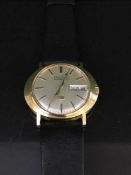 A scarce 9ct gold Bulova Accuquartz wristwatch with Day-Date indication,