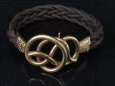 A fine Victorian hair ornament with ornate gold mount