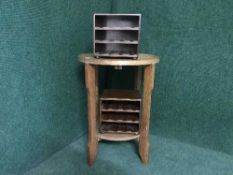 A circular oak occasional table and two desk top storage shelves